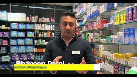 Pharmacist speaking in a pharmacy in the NHS medicine wastage YouTube campaign